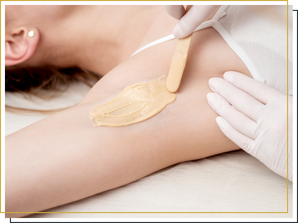 woman getting an armpit waxing